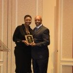 Alethea R_ Bonello honored with a  plaque by Irving NAACP President Tony Grimes