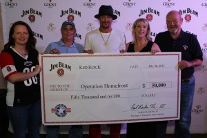 L-R: Amy Palmer, COO Operation Homefront; Ralph Harroff, Operation Homefront Recipient; Kid Rock; Lorie Harroff, Operation Homefront Recipient; Fred Noe, Jim Beam 7th Generation Master Distiller   