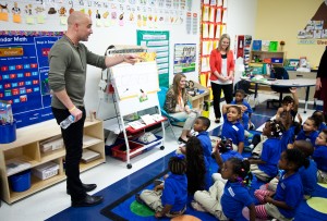 Andre Agassi, co-managing partner of the Canyon-Agassi Charter School Facilities Fund, interacts with students at KIPP Destiny Elementary.