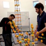 Lyle Engineering students Andrew George (left) and Matt Tonnemacher test the WABA Fun Superstructs™ before the competition begins Friday evening.