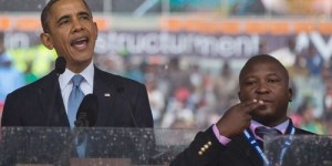 President of United States on stage next to a convicted theft and man charged with murder and rape. Source: YourBlackWorld.com. 