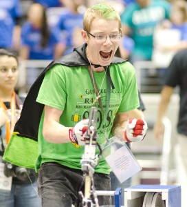 Caleb Holets, a member of the Rio Rancho Robo Runners team from New Mexico, celebrated at the 2013 Texas BEST Regional Robotics Championship.