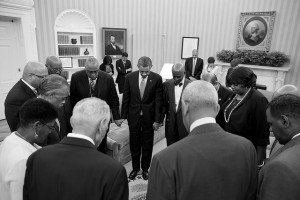 President Barack Obama prays with faith leaders in the Oval Office following a meeting to discuss the 50th anniversary of the March on Washington for Jobs and Freedom, Aug. 26, 2013. (Official White House Photo by Pete Souza)