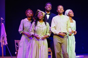 Emani Washington, left, Britani Washington, Karl Kumodzi, Robert Poole and Briana Washington sing ''Oh Freedom'' in a scene from Movement 1: But the Blood, in Stanford student Jessica Anderson's "Higher Ground: A Gospel Musical." (Photo: John C. Liau / Courtesy of Stanford University)