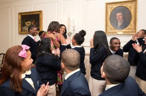 First Lady Michelle Obama and Dr. Jill Biden greet students from Orchard Gardens in Boston, Mass. after the students performed at a luncheon for National Governors Association (NGA) spouses, in the Map Room of the White House, Feb. 24, 2014. (Official White House Photo by Amanda Lucidon)