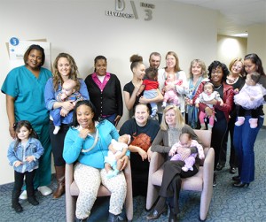 A recent reunion of the Life Shines Bright Pregnancy Program at Methodist Charlton included  participating moms, dads, and babies. The program’s first patient, Sarah Santibanez, was  also present (standing second from left). Staff members joining in are Patient Care  Technician Kendra Warner and certified nurse-midwives Tracy Trenhaile-Sellers, Debra  Knipe, and Susan Storry.