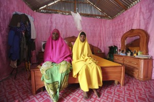Saciido Sheik Yacquub, 34, poses for a picture with her daughter Faadumo Subeer Mohamed, 13, at their home in Hodan district IDP camp in Mogadishu February 11, 2014. Credit: Reuters via Yahoo