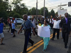 Capt. Ron Johnson of the Missouri State Highway Patrol walks with protesters on Wed. night according to photo shared via Twitter by @JamilSmith