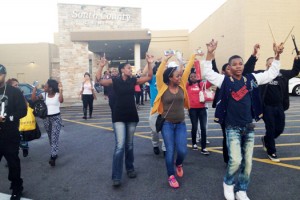 Protestors walk out of mall after shutting down stores in efforts to inflict economic pain as part of strategies to obtain justice. Photo: NNPA 