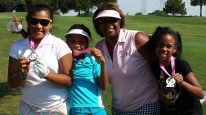 The young ladies and mentors enjoy a fun time during Pink Tee clinics.