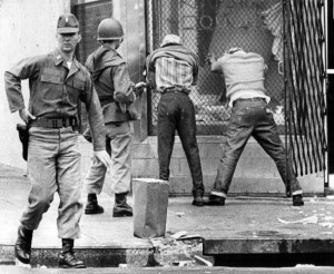 Soldiers hold two looters caught on Biddle Street near Madison during the 1968 riots that followed the killing of Dr. Martin Luther King Jr. in April. (Paul Hutchins/Baltimore Sun)