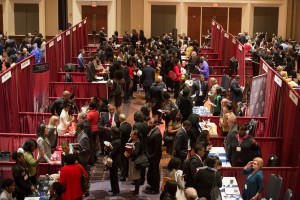 Students meet with different schools at a recent college fair. 