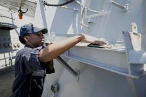 Logistics Specialist 2nd Class Kiana Royal, from Mesquite, Texas, cleans the exterior of USS Ross (DDG 71) during a fresh water washdown July 12, 2015. Ross, an Arleigh Burke-class guided-missile destroyer, forward-deployed to Rota, Spain, is conducting naval operations in the U.S. 6th Fleet area of operations in support of U.S. national security interests in Europe. (U.S. Navy photo by Mass Communication Specialist 3rd Class Robert S. Price/Released)