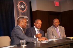 U. S. Black Chamber President/CEO Ron Busby signs Memorandum of Understanding with NAMAD President Damon Lester. Marc Bland, IHS vice president of diversity and inclusion, looks on. (Trice Edney News Wire) 