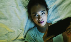 "Students who have tablets or TVs or computers—even an 'old-school' flashlight under the covers to read—are pushing their circadian clocks to a later timing," says Mary Carskadon. "This makes it harder to go to sleep and wake up at times early the next morning for school." (Credit: iStockphoto)