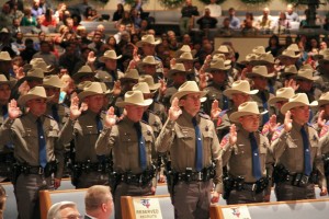 Texas DPS graduating class taking the oath of Courtesy, Service, Protection. 