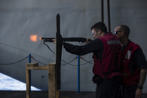 WATERS SOUTH OF JAPAN (Nov. 19, 2015) Seaman Stephen Smith, from Dallas, fires an M500 12-gauge shotgun during a live-fire practical weapons course aboard the U.S. Navy's only forward-deployed aircraft carrier USS Ronald Reagan (CVN 76). Ronald Reagan and its embarked air wing, Carrier Air Wing (CVW) 5, provide a combat-ready force that protects and defends the collective maritime interests of the U.S. and its allies and partners in the Indo-Asia-Pacific region. (U.S. Navy photo by Mass Communication Specialist 2nd Class Paolo Bayas/Released) 