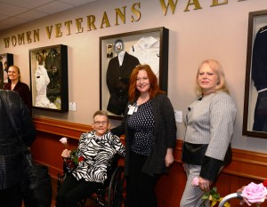 Marine Corps Veteran Brenda Powell (seated) and Navy Veteran Constance Lewis, ARNP’s service photos were among the items featured on the Women Veterans Wall of Honor; a project guided by Geriatrics & Extended Care Physician Assistant Pam Korzeniowski, PA-C (center).