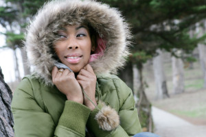 Portrait of young African American woman in fur hooded coat.