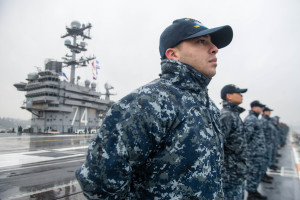 PUGET SOUND (Jan. 15, 2016) Machinist's Mate Fireman Edgar David Acosta, from Dallas, mans the rails on USS John C. Stennis' (CVN 74) flight deck as the ship gets underway for a regularly scheduled deployment. Providing a combat-ready force to protect and defend collective maritime interests, Stennis is operating in the U.S. 3rd Fleet area of operations for a Western Pacific deployment. (U.S. Navy photo by Mass Communication Specialist 2nd Class Jonathan Jiang / Released) 