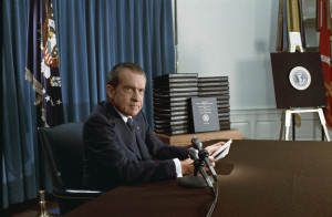 Impeached President Nixon with his edited transcripts of the White House Tapes subpoenaed by the Special Prosecutor, during his speech to the Nation on Watergate