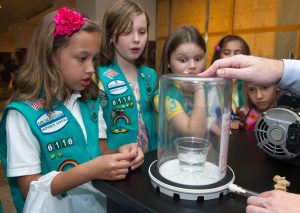 Unidentified Girl Scouts react in different ways to water bubbling in a vacuum chamber during the Girl Scouts Rock @NASA event, Friday, June 8, 2012, at NASA Headquarters in Washington. NASA helped mark the 100th anniversary of the Girl Scouts of America by hosting the event at headquarters where they were able participate in hands on activities, meet with scientists and learn more about science, technology, engineering and mathematics (STEM) in exciting and innovative ways. Photo Credit: (NASA/Paul E. Alers via Flickr)