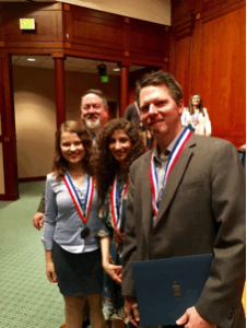 Back Row: Collin College District President Dr. Neil Matkin and students (front row, left to right) Anna Cavnar, Mona Azzo and David Schletewitz at the award ceremony in Austin.