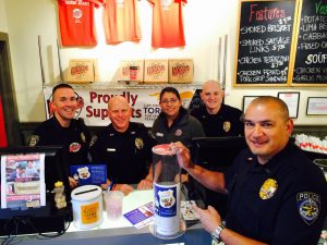 Cops and Law Enforcement Torch Run members will serve table for tips, which will be donated to support  local Special Olympics Texas athletes.