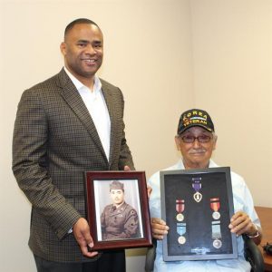 Congressman Marc Veasey, TX-33, awards Purple Heart and other medals to Dallas resident and Korean War veteran, Mr. Marcos Torres.  (Courtesy image)