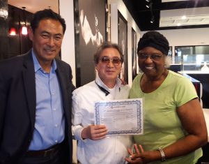 ******Picture of the Week****** Mr. Young Sung, Community Leader, Mr. Bobby Kim, Founder/CEO of Breakers Korean BBQ in Carrollton, TX and Sister Tarpley, displaying Breakers Certificate of Occupation (CO) to open and serve the public delicious BBQ 