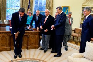 President Barack Obama practices with a golf club after the signing ceremony for H.R. 1243, the Arnold Palmer Congressional Gold Medal Act, in the Oval Office, Sept. 30, 2009. (Official White House photo by Samantha Appleton) 