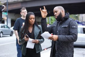 David E. Talbert (at right) gives instructions on set to Gabrielle Union during recent filming. (Courtesy photo)