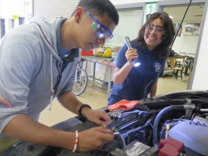  Damian (left) and Esmeralda are students in Adamson High School’s automotive technology program. (DISD) 