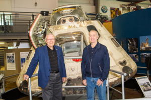 Capt. Fred Haise (Apollo 11), and Col. Walt Cunningham (Apollo 7), in front of the Apollo 7 space capsule at the Frontiers of Flight Museum. 